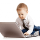 toddler working on a laptop
